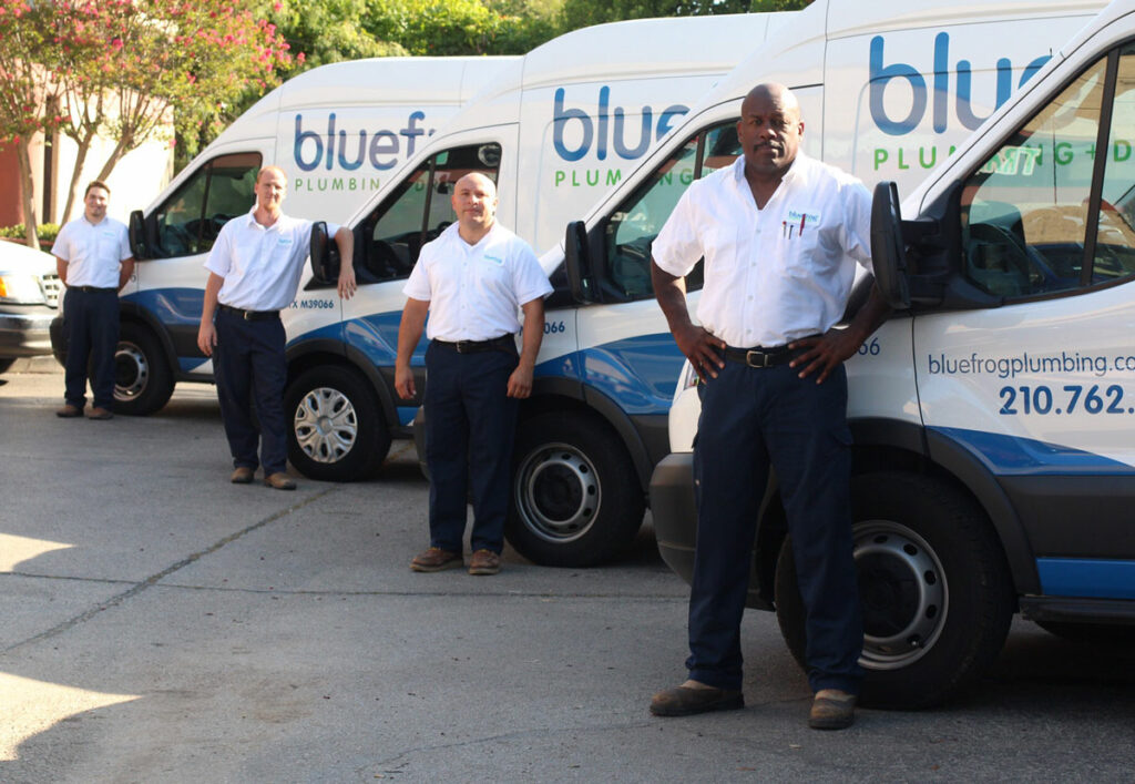 bluefrog Plumbing + Drain franchise plumbing franchise owners in front of trucks