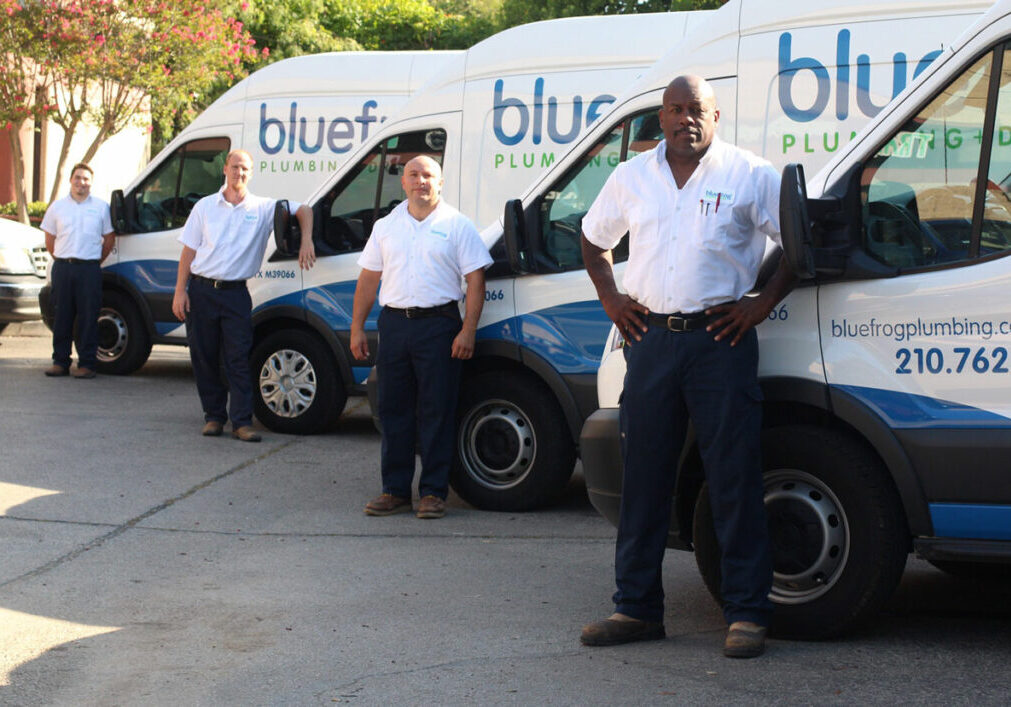 bluefrog Plumbing + Drain plumbing franchise owners in front of trucks